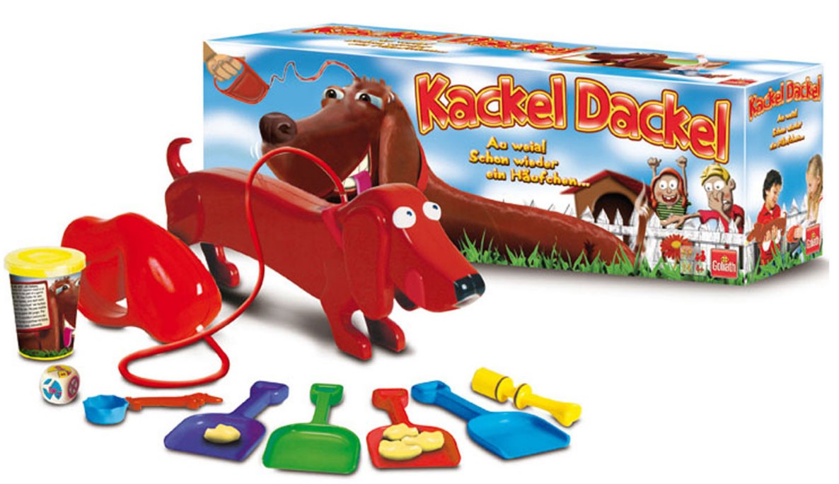 Гуляй игрушки. Какель Дакель. Игрушка такса которая какает. Настольная игра собака. Игрушка собака с какашками.